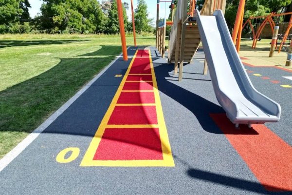 "playground-turf-installation-pukete-park-colourful-surface" - "custom-playground-turf-installation-coolplay-colours-running-track" - "professional-playground-turf-installation-shock-pad-safety" - "synthetic-playground-turf-installation-hand-cut-numbers" - "durable-playground-turf-installation-prepared-base"
